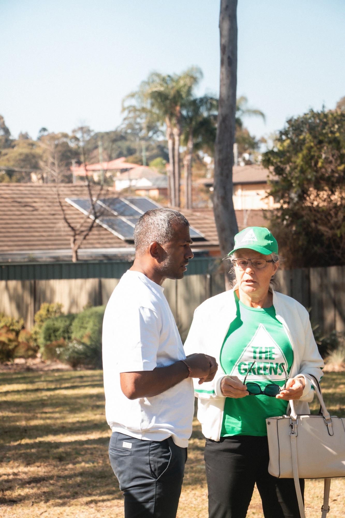 Sujan speaking with a local resident